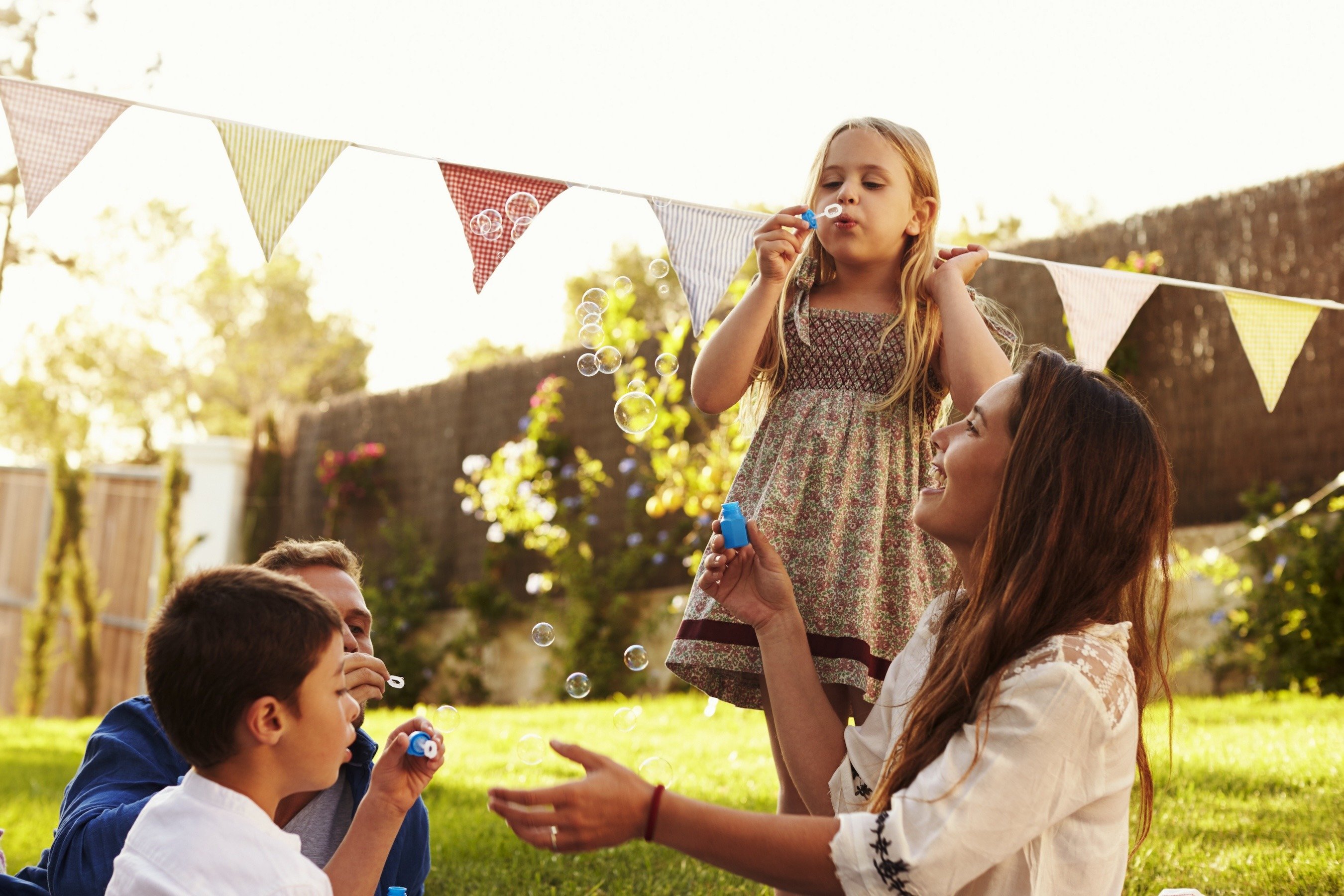 blowing bubbles in the lawn