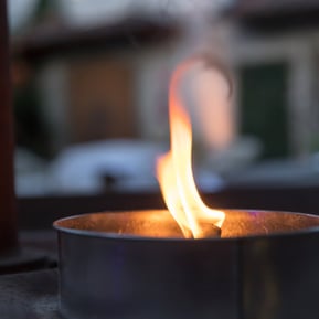 flame-burning-brightly-in-small-metal-container-2026-03-16-04-23-45-utc